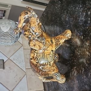 Blown ceramic elephant 🐘 gold brown black white in colors zebra leopard design.